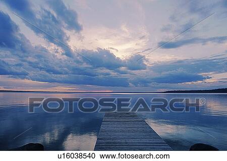 Stock Image - Public dock Clear Lake; Canada, Manitoba, Riding Mountain National Park. Fotosearch