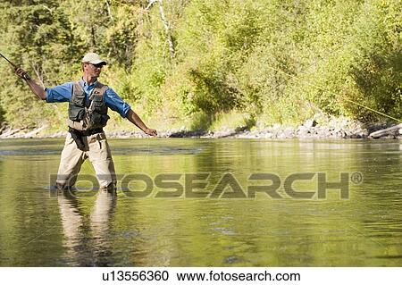 Fly-fishing guide, Russ Trand, fly-fishing on tributary of Elk River near Fernie, Elk Valley, East Kootenays, British Columbia, Canada. View Large Photo Image Stock Image - Fly-fishing guide, Russ Trand, fly-fishing on tributary of Elk River near Fernie, Elk Valley, East Kootenays, British Columbia, Canada.. Fotosearch