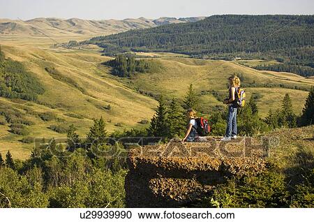 Stock Image - Sisters (13 and 10) view lookout, Saskatchewan. Fotosearch