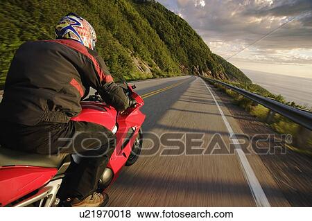 Stock Photo - View on Motorcycle in action on Cabot Trail, Cape Breton Highlands National Park, Nova Scotia, Canada. Fotosearch