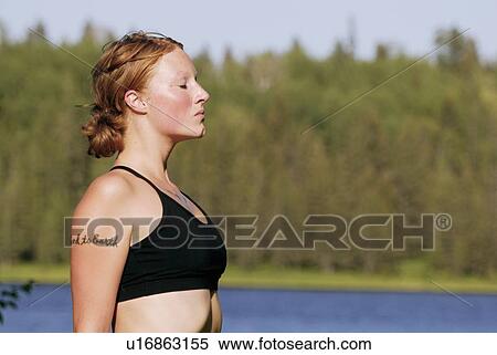 Woman in with eyes closed, beside Grayling Lake, Riding Mountain National Park, Manitoba, Canada View Large Photo Image Stock Photography - Woman in with eyes closed, beside Grayling Lake, Riding Mountain National Park, Manitoba, Canada. Fotosearch