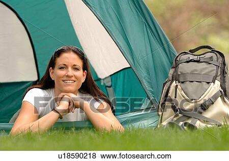 Young woman laying out front of tent, Regina, Saskatchewan View Large Photo Image Stock Photo - Young woman laying out front of tent, Regina, Saskatchewan. Fotosearch
