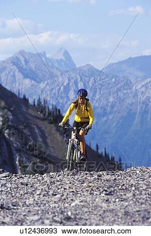 Young woman mountain biking at Fernie Alpine Resort, Fernie, BC, Canada View Large Photo Image Stock Image - Young woman mountain biking at Fernie Alpine Resort, Fernie, BC, Canada. Fotosearch