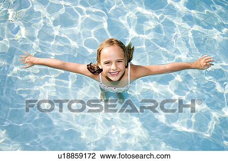 Stock Image - Girl - (5) swimming in a pool, Jacksonville, Florida. Fotosearch