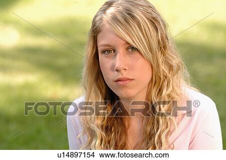 Portrait of young blonde girl on grass, Regina, Saskatchewan View Large Photo Image Picture - Portrait of young blonde girl on grass, Regina, Saskatchewan. Fotosearch