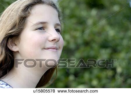 Stock Photo - Twelve year old girl in Assiniboine Park, Winnipeg, Canada. Fotosearch