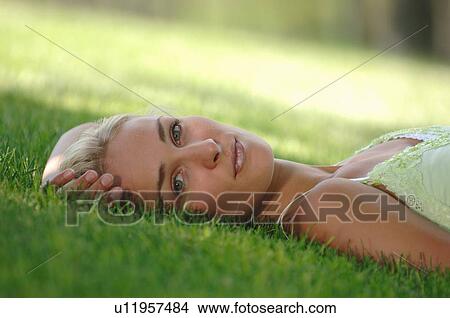Picture - Young blonde female in park, Regina, Saskatchewan. Fotosearch