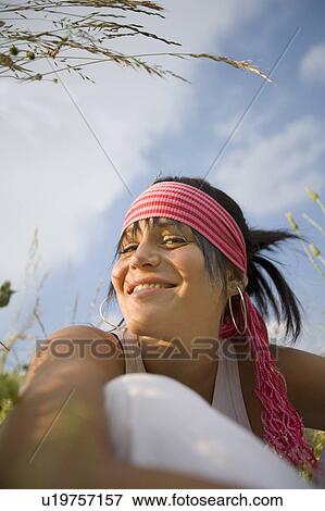 Stock Photo - Young woman (19) in alpine meadow, Servoz, Haute Savoie, France. Fotosearch