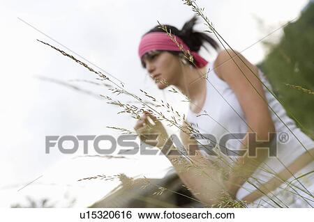 Stock Photograph - Young woman (19) in alpine meadow, Servoz, Haute Savoie, France. Fotosearch