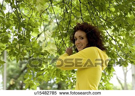 Young woman holding branches, Winnipeg, Canada View Large Photo Image Stock Photography - Young woman holding branches, Winnipeg, Canada. Fotosearch