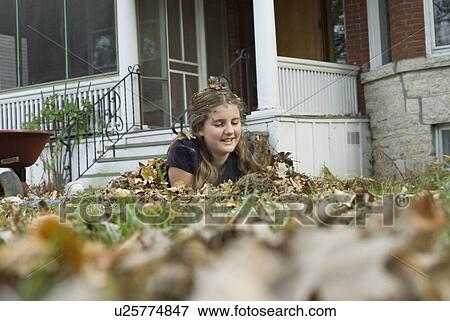 Teen girl covered in leaves, Winnipeg, Canada View Large Photo Image Stock Photo - Teen girl covered in leaves, Winnipeg, Canada. Fotosearch