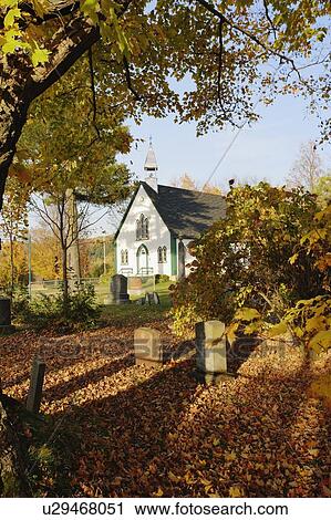 Stock Image - View of Holy Trinity Church Iron Hill Anglican in autumn landscape, Eastern Townships, Quebec, Canada.. Fotosearch