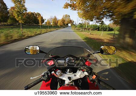 Stock Image - View on Motorcycle in action, Eastern Townships, Quebec, Canada. Fotosearch