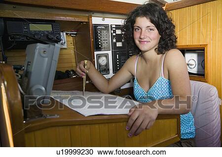 14 Year Year Old at the Navigation Station of a Sailboat View Large Photo Image Stock Image - 14 Year Year Old at the Navigation Station of a Sailboat. Fotosearch