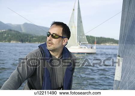 Stock Image - Sail racing, West Vancouver Yacht Club, West Vancouver, BC Canada. Fotosearch