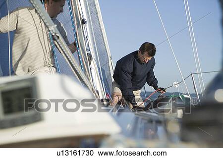 Stock Image - Sail racing, West Vancouver Yacht Club, West Vancouver, BC Canada. Fotosearch
