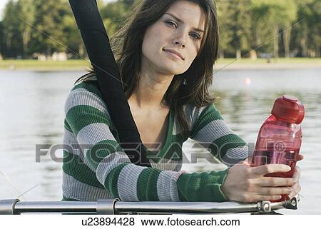 Woman holding reuseable water bottle on sailboat, Clear Lake, Riding Mountain National Park, Manitoba, Canada View Large Photo Image Stock Photo - Woman holding reuseable water bottle on sailboat, Clear Lake, Riding Mountain National Park, Manitoba, Canada. Fotosearch