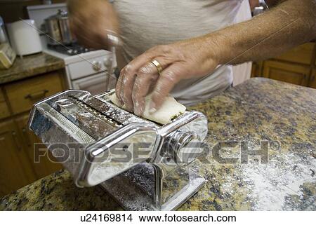 Picture - Making pasta at home, Okanagan Centre, BC Canada. Fotosearch