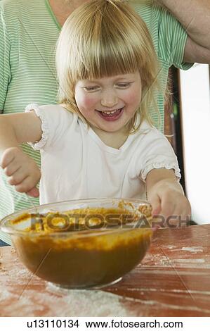 Picture - Young Girl Helping to Make a Pumpkin Pie, Vancouver, B. C.. Fotosearch