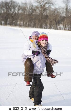 13 year old carries 9 year old up hill on back, Winnipeg, Canada View Large Photo Image Stock Image - 13 year old carries 9 year old up hill on back, Winnipeg, Canada. Fotosearch