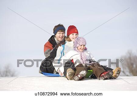 15, 13 and 9 year olds prepare to slide down hill, Winnipeg, Canada View Large Photo Image Picture - 15, 13 and 9 year olds prepare to slide down hill, Winnipeg, Canada. Fotosearch