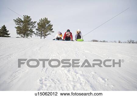 3 kids (14, 13 and 9 years old) prepare to slide down hill, Winnipeg, Canada View Large Photo Image Stock Image - 3 kids (14, 13 and 9 years old) prepare to slide down hill, Winnipeg, Canada. Fotosearch