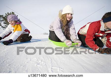 3 kids (14, 13 and 9 years old) sliding down hill, Winnipeg, Canada View Large Photo Image Stock Image - 3 kids (14, 13 and 9 years old) sliding down hill, Winnipeg, Canada. Fotosearch