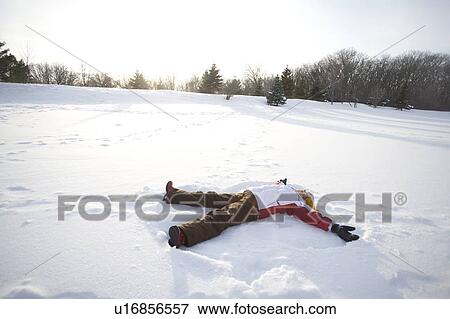 9 year old lying on snow, making snow angel, Winnipeg, Canada View Large Photo Image Stock Photo - 9 year old lying on snow, making snow angel, Winnipeg, Canada. Fotosearch