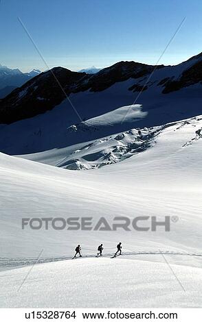 Alpinists walking on Mont Ruitor, Savoie, France View Large Photo Image Picture - Alpinists walking on Mont Ruitor, Savoie, France. Fotosearch