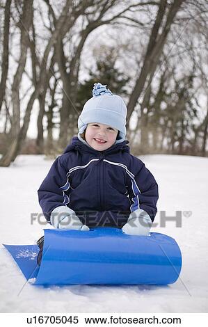 Child on snow slider, Regina, Saskatchewan, Canada View Large Photo Image Stock Photography - Child on snow slider, Regina, Saskatchewan, Canada. Fotosearch