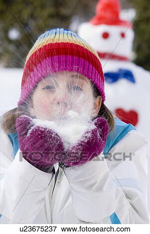Thirteen year old girl blowing snow toward camera, Winnipeg, Canada View Large Photo Image Stock Photo - Thirteen year old girl blowing snow toward camera, Winnipeg, Canada. Fotosearch