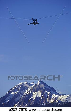 Stock Photo - Traversing Between Two Peaks, Squamish, BC, Canada. Fotosearch