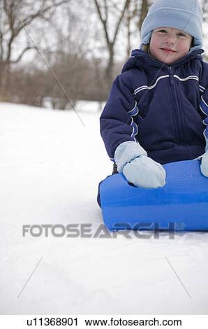 Young child on sled, Regina, Saskatchewan, Canada View Large Photo Image Stock Image - Young child on sled, Regina, Saskatchewan, Canada. Fotosearch