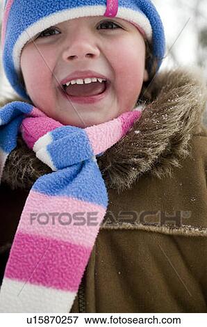 Stock Photo - Young girl in winter hat and scarf, Regina, Saskatchewan, Canada. Fotosearch