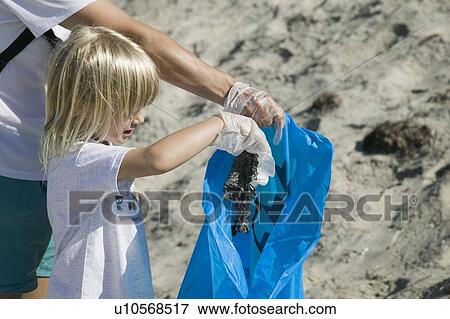 Stock Photo - Beach clean up on Rivers Day, San Diego, California. Fotosearch