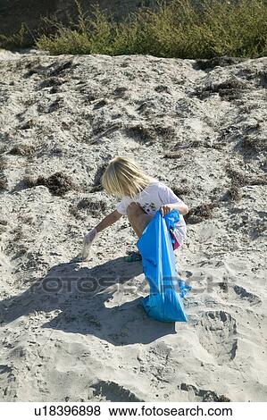 Stock Photo - Beach cleanup on River's Day, San Diego, California. Fotosearch