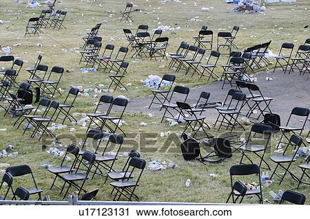 Stock Image - Chairs and garbage after a rock concert, SARS concert in Toronto. Fotosearch