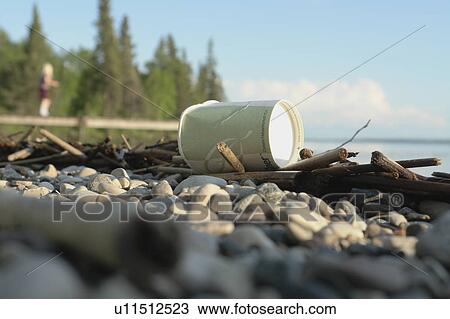 Stock Image - Corn-based compostable cup on dock, Clear Lake, Ridign Mountain National Park, Canada. Fotosearch