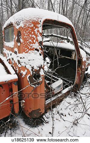 Stock Photo - View of truck in junkyard. Montérégie region, Quebec. Fotosearch