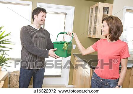 Woman hands kitchen compost bin to man, Winnipeg, Canada View Large Photo Image Stock Image - Woman hands kitchen compost bin to man, Winnipeg, Canada. Fotosearch