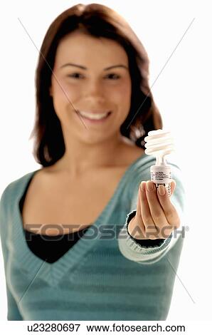 Stock Photo - Young girl w/Light bulb, Regina, Saskatchewan. Fotosearch