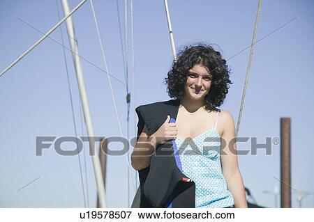 Stock Photo - 14 Year Old Girl With Dive Gear on a Sailboat. Victoria, BC.. Fotosearch