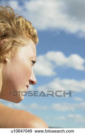 Profile of woman against a blue sky, Lake Katherine, Riding Mountain National Park, Manitoba, Canada View Large Photo Image Stock Photo - Profile of woman against a blue sky, Lake Katherine, Riding Mountain National Park, Manitoba, Canada. Fotosearch