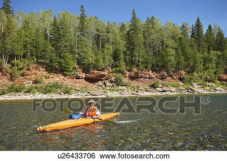 Stock Photograph - View of kayak on Bonaventure river, Gaspesie, Quebec. Fotosearch