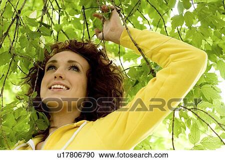 Woman under canopy of branches, Winnipeg, Manitoba, Canada View Large Photo Image Stock Image - Woman under canopy of branches, Winnipeg, Manitoba, Canada. Fotosearch