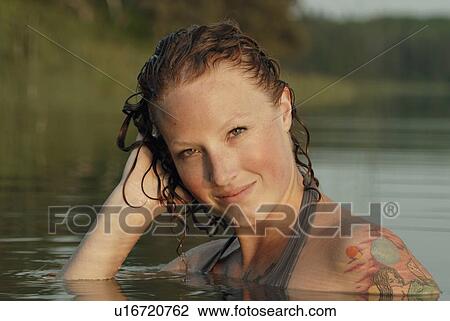 Woman with hand to wet head in lake, Lake Katherine, Riding Mountain National Park, Manitoba, Canada View Large Photo Image Stock Image - Woman with hand to wet head in lake, Lake Katherine, Riding Mountain National Park, Manitoba, Canada. Fotosearch