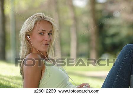 Young blonde female in park with ipod, Regina, Saskatchewan View Large Photo Image Stock Photo - Young blonde female in park with ipod, Regina, Saskatchewan. Fotosearch