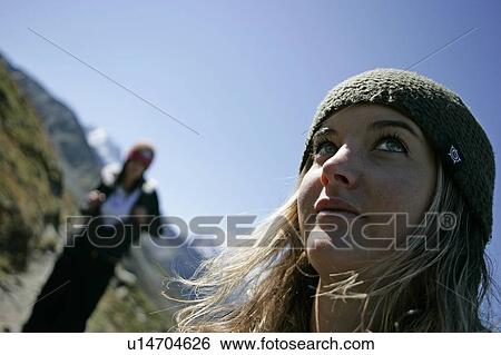 Stock Photograph - Young girls (19) hiking in front of Mont Blanc, Chamonix, France. Fotosearch