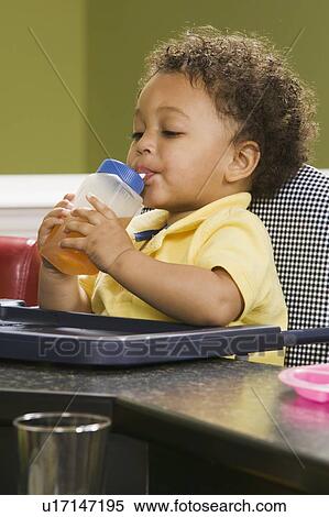 1. 5 year old Mulatto boy drinking juice. View Large Photo Image Stock Photography - 1. 5 year old Mulatto boy drinking juice.. Fotosearch
