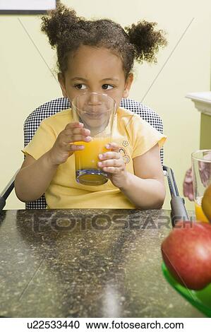 3 year old Mulatto girl drinking juice. View Large Photo Image Stock Image - 3 year old Mulatto girl drinking juice.. Fotosearch